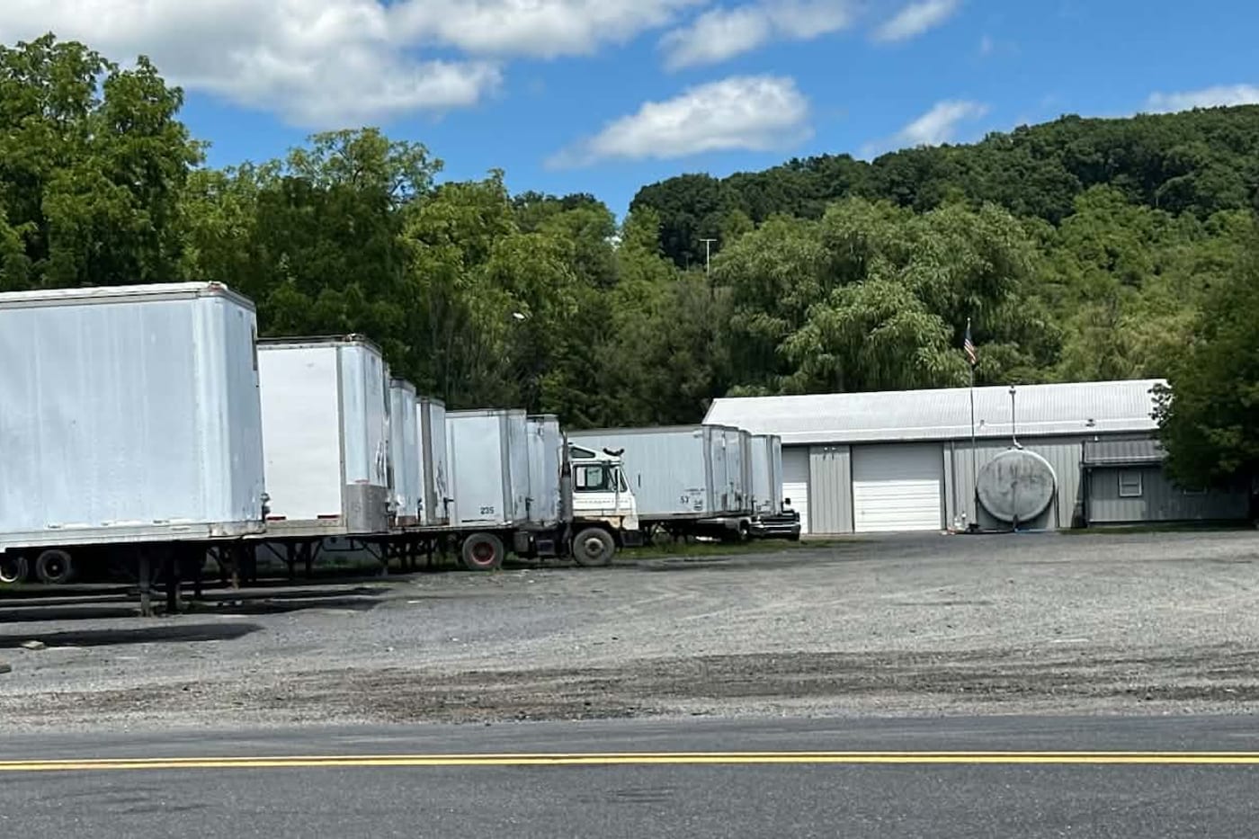 A line of Penn Turf collection trailers staged at the Hollidaysburg facility, ready to go out on route